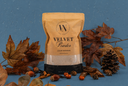 A package of Velvet Powder on a blue background with decorative fall elements. 