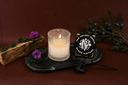 Black Vintage Single Wick Candle on a dark surface with decorative elements