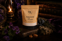 Package of Velvet Powder with a candle and books in the background