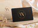 Black card with gold logo and text on a beige background