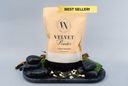 Bag of Velvet Powder with decorative stones and plants on a gray background