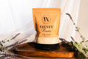 Package of Velvet Powder with lavender flowers on a wooden board