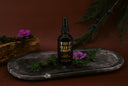 Velvet Drops on a dark background with decorative elements.