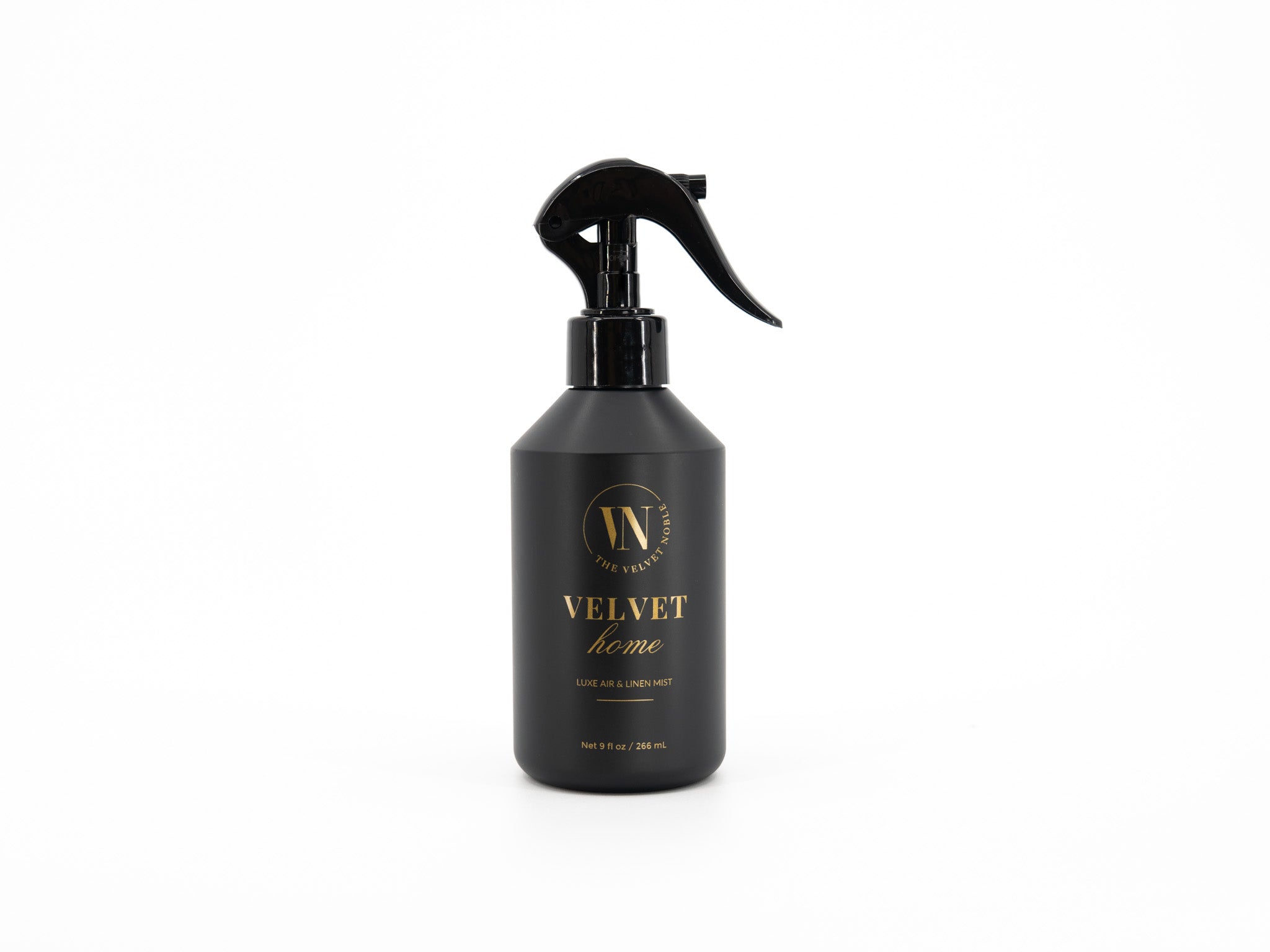 Black spray bottle with 'Velvet Home' branding on a white background