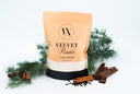 Bag of Velvet Powder with cinnamon sticks and pine branches on a white background