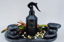 Black spray bottle labeled 'Velvet Home' on a decorative stone tray with plants, featuring 'Limited Edition' text.