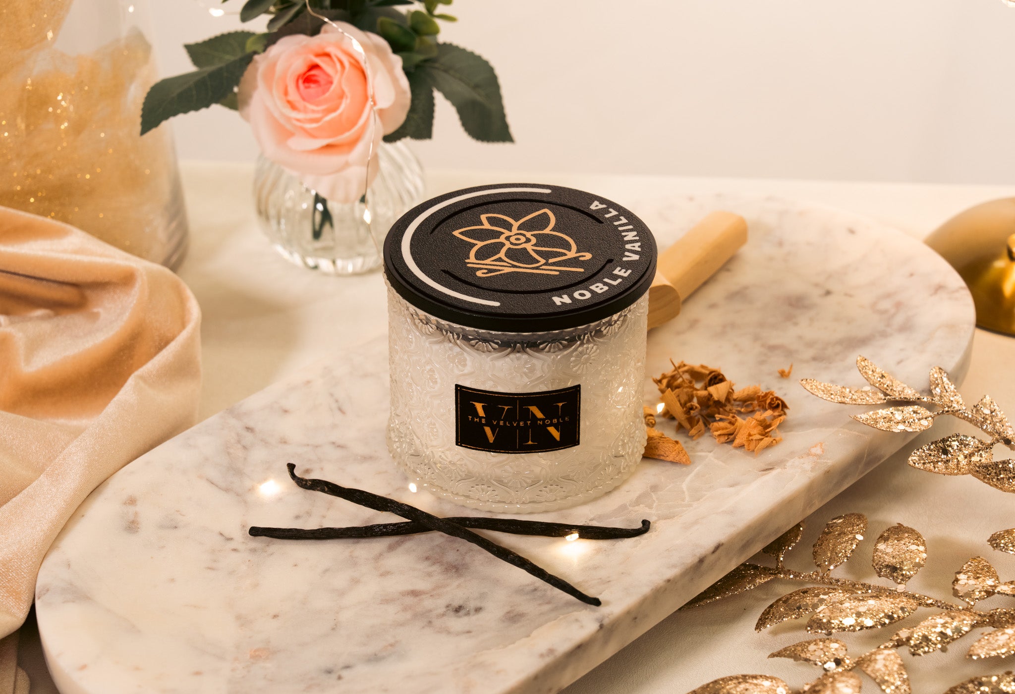 Vanilla Candle on a marble surface with decorative elements