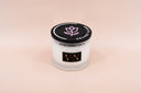 Velvet Flora Candle on a beige background.