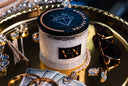 Velvet Stacks 2-Wick Candle on a gold tray with Jewelry, Cash, and Sunglasses