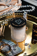 Velvet Stacks Single Wick on a gold tray with jewelry, sunglasses, and cash
