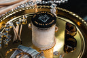 Velvet Stacks Single Wick on a gold tray with jewelry, sunglasses, and cash