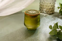 Velvet Ease with a decorative lid on a reflective surface