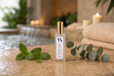 Velvet Ease Mini Air & Linen Mist with mint & eucalyptus leaves on a spa-like setting