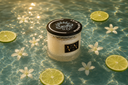 Morning Mist Candle in a pool of fresh, clear water with Citrus and flowers.