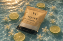 Velvet Powder Carpet & Upholstery Powder in a pool of fresh, clear water with Citrus and flowers.
