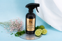 Spray bottle labeled 'Velvet Sparkle' on a light blue background with decorative elements.
