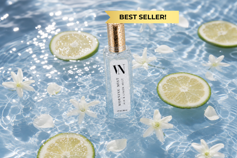 Morning Mist Mini Air & Linen Mist with lime slices and flowers on a water surface