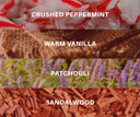 Four horizontal strips showing scent notes for a fragrance: crushed peppermint with white and red flakes, warm vanilla with brown textured material, patchouli with green leaves and purple flowers, and sandalwood with reddish-brown wood chips. White text labels each note.