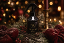 A black trigger spray bottle labeled 'Velvet Home' stands on a decorated holiday surface with pine branches, red velvet bows, vanilla beans, and warm blurred lights in the background.