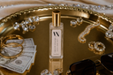 Velvet Stacks Mini Air & Linen mist on a gold tray with jewelry and money.