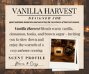 A product information card for 'Vanilla Harvest' scented candle. The card features a warm beige background with black text detailing the scent profile of vanilla, cinnamon, tonka, and brown sugar, designed for cozy autumn evenings.