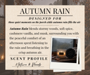 A product information card for 'Autumn Rain' scent, featuring a warm beige background with elegant black typography and a small polaroid-style photo of the candle jar and lid on a windowsill.