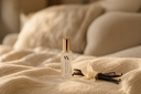 Noble Vanilla Mini Air & Linen mist with vanilla beans on a textured surface