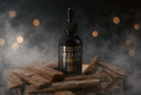 A dark amber glass dropper bottle labeled 'VELVET DROPS' stands centered on stacked wood pieces with mist and warm blurred lights in the background.