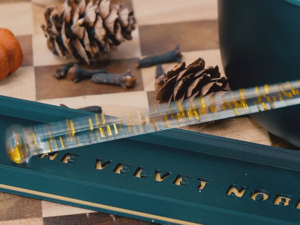 A video including a wickless candle being stirred and shinning beautifully with each swirl.